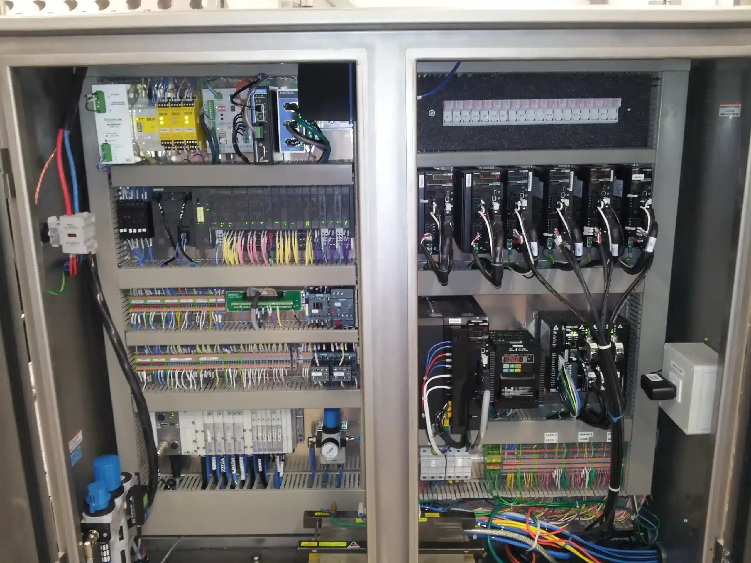 Industrial automation control panel with electrical and control components
